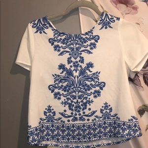 Quite and navy blue blouse.